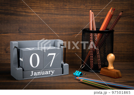 7 January inscription on wooden calendar. Wooden office desk 7 January inscription on wooden calendar. Wooden office desk 97501865