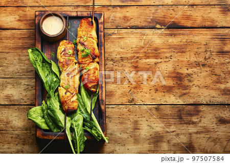 Chicken breast fried on skewers. Chicken breast fried on skewers. 97507584