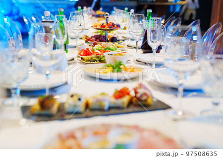 snacks and empty wine glasses on the table. catering  97508635