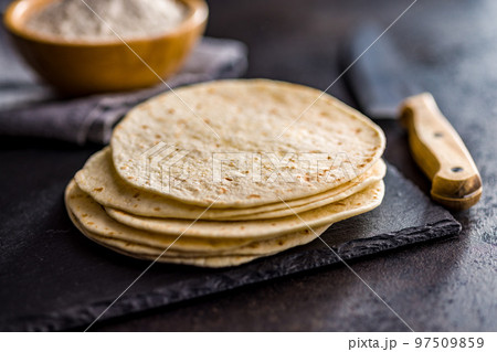 Mexican Corn Tortillas on kitchen table. 97509859