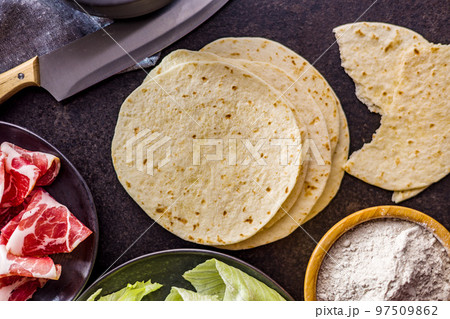 Mexican Corn Tortillas on kitchen table. 97509862