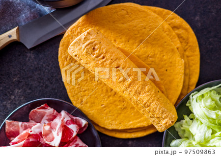 Mexican Corn Tortillas on kitchen table. 97509863