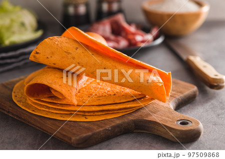 Mexican Corn Tortillas on cutting board. Mexican Corn Tortillas on cutting board. 97509868