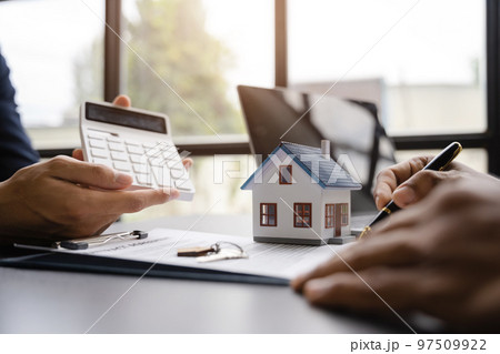 Home Insurance and Real estate investment concept,  new client after signing agreement contract with approved property application form. 97509922