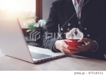 Cloud computing technology concept with businessman and smartphone, notebook (Laptop). Big data analytics and business intelligence concept with chart and graph icons on a digital screen interface. Cloud computing technology concept with businessman and smartphone, notebook (Laptop). Big data analytics and business intelligence concept with chart and graph icons on a digital screen interface. 97516531