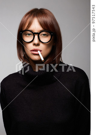 pretty hooligan girl with cigarette 97517543