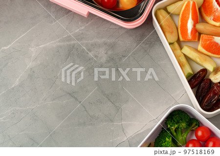 Containers with healthy food on gray background top view. Containers with healthy food on gray background top view. 97518169