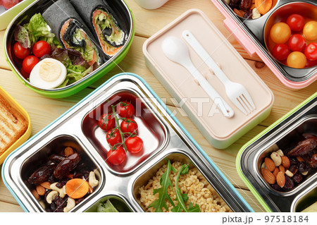 Containers with healthy food on wooden background top view. Containers with healthy food on wooden background top view. 97518184