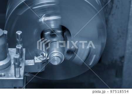 Close up scene the lathe machine finish cut the metal shaft parts by insert tools. 97518554