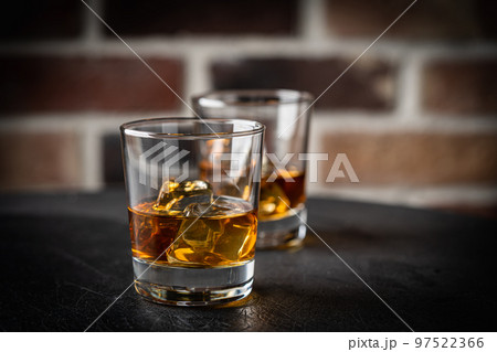 Whiskey with ice in glasses 97522366