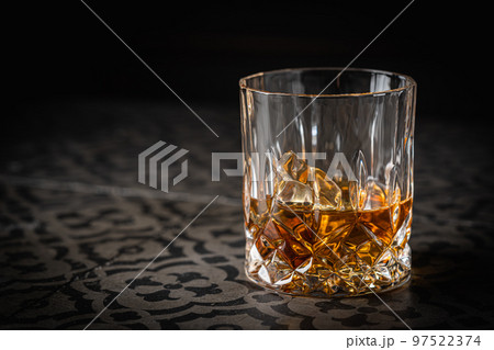 Whiskey with ice in glasses 97522374