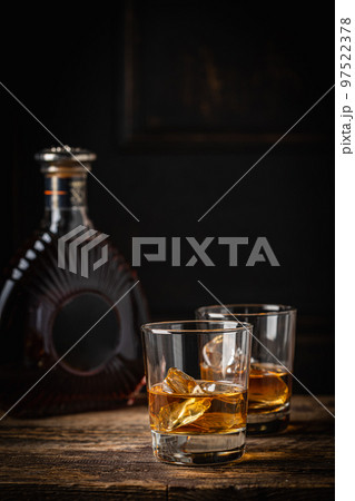 Whiskey with ice in glasses 97522378