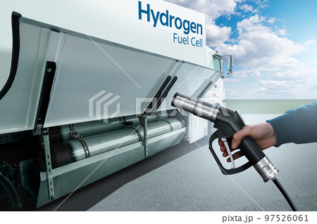 Hand with H2 nozzle on a background of hydrogen fuel cell semi truck  97526061