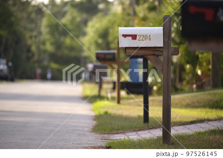 Typical american outdoors mail box on suburban street side 97526145