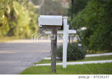 Typical american outdoors mail box on suburban street side Typical american outdoors mail box on suburban street side 97526147