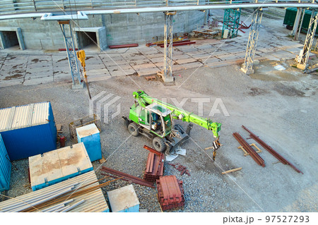 Lifting crane tractor on industrial construction site. Heavy duty machinery for building industry 97527293