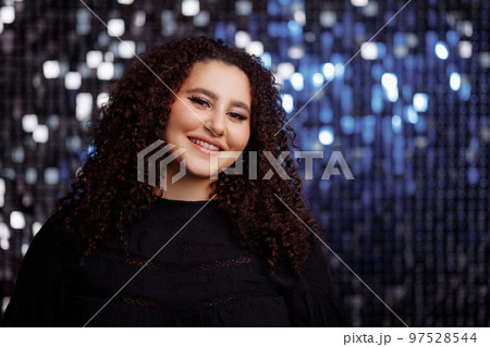 Girl with a curly hairstyle 97528544