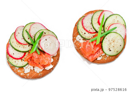 Cracker Sandwiches with Salmon, Cucumber, Radish, Cottage Cheese and Green Onions - Isolated Cracker Sandwiches with Salmon, Cucumber, Radish, Cottage Cheese and Green Onions - Isolated 97528616