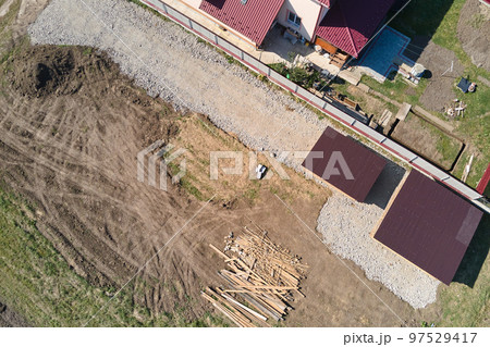 Aerial view of residential house with backyard in suburban rural area 97529417