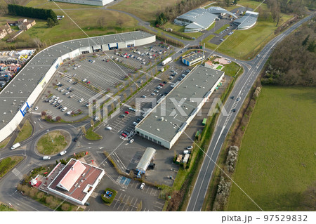 Aerial view of goods warehouses and logistics center in industrial city zone from above Aerial view of goods warehouses and logistics center in industrial city zone from above 97529832