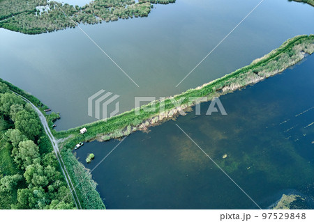 Aerial view of fish hetching pond with blue water in aquacultural area 97529848