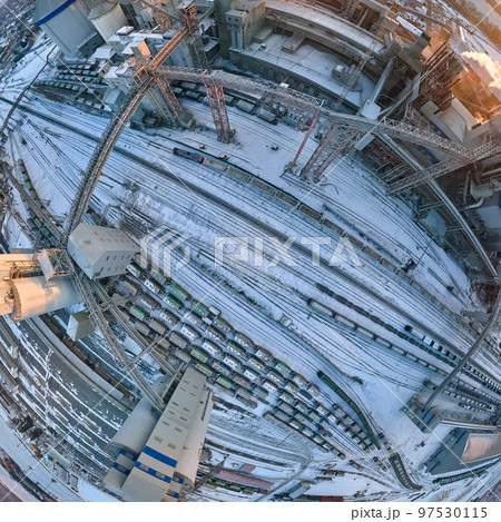 Aerial view of cargo train cars loaded with construction goods at mining factory. Railway transportation of industrial production raw materials Aerial view of cargo train cars loaded with construction goods at mining factory. Railway transportation of industrial production raw materials 97530115