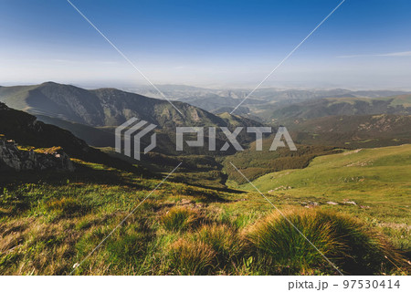 Summer Landscape with Mountain Range under Blue Sky Summer Landscape with Mountain Range under Blue Sky 97530414