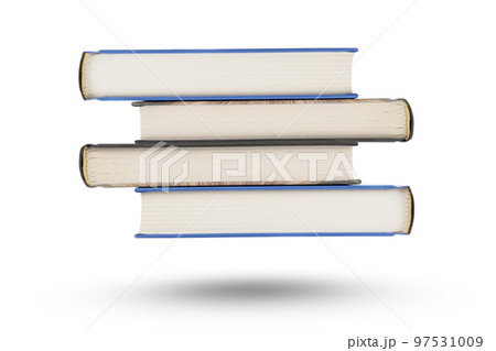 stack of books, isolate on white background. A stack of books of varying thickness falls, casting a shadow. Books are isolated on a white background, hanging in the air. 97531009