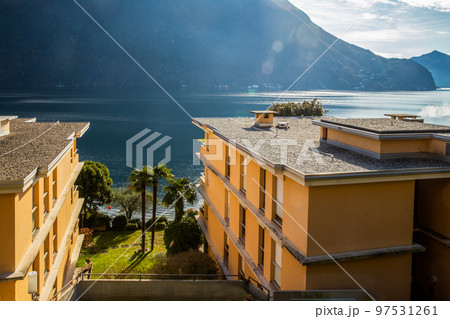 4-story apartment buildings on coastline of Lake Lugano 4-story apartment buildings on coastline of Lake Lugano 97531261