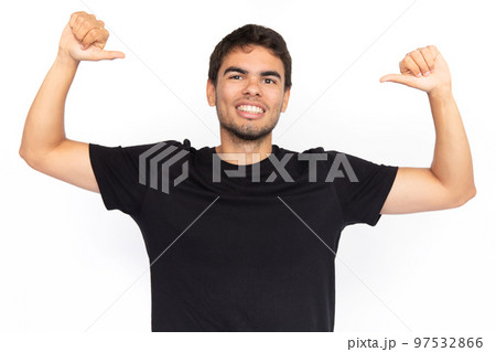 Excited young man pointing thumbs at himself 97532866