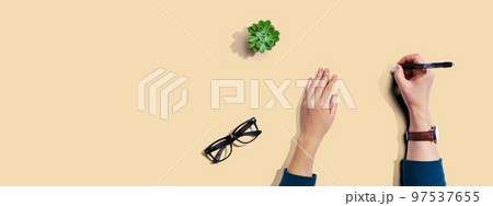 Person writing something with a pen 97537655