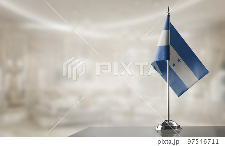 A small Honduras flag on an abstract blurry background A small Honduras flag on an abstract blurry background 97546711