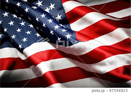 風に意気揚々と翻るアメリカ合衆国の旗 97548923