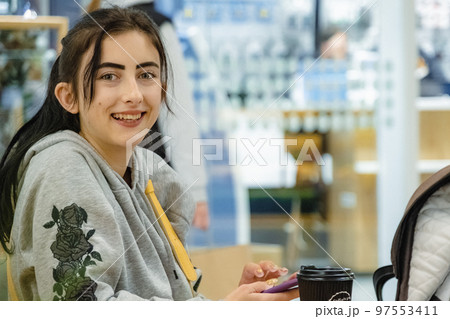 Woman visits market with coffee on table and enjoys shopping Woman visits market with coffee on table and enjoys shopping 97553411