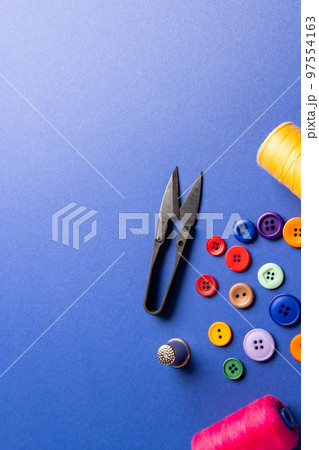 Composition of sewing equipment on blue background with copy space 97554163