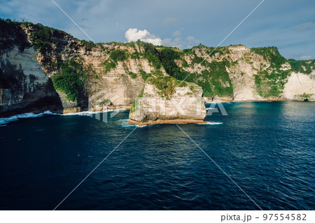 Coastline with cliffs and ocean in Nusa Penida, Indonesia. Aerial view 97554582