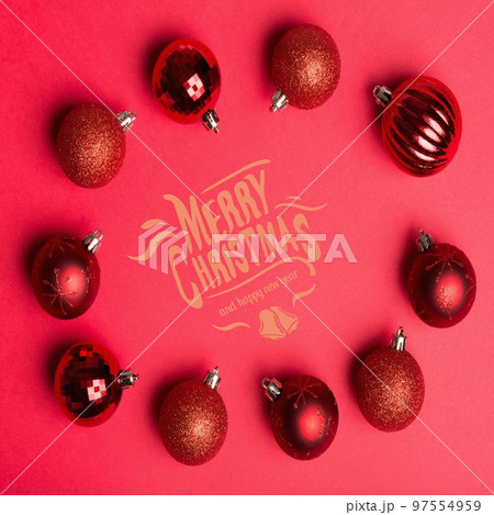 Merry christmas and happy new year text banner against red baubles on red background Merry christmas and happy new year text banner against red baubles on red background 97554959