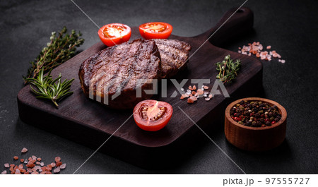 Delicious fresh juicy beef steak with spices and herbs 97555727