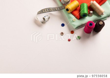 Composition of sewing equipment on white background Composition of sewing equipment on white background 97556058