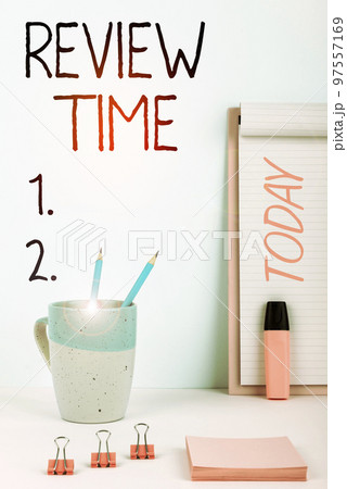 Hand writing sign Review Time. Business approach situation or system its formal examination by people authority 97557169