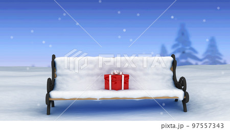 Image of snow falling over christmas present on bench covered in snow in winter scenery 97557343