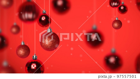 Image of snow falling over christmas bauble decorations on red background Image of snow falling over christmas bauble decorations on red background 97557501