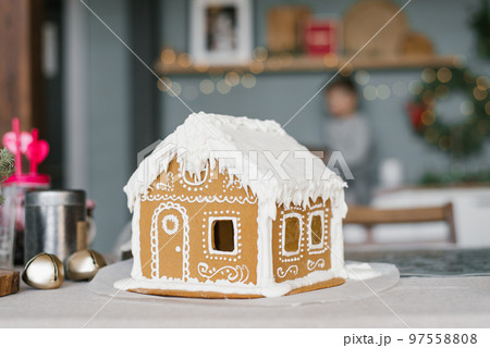 Christmas gingerbread house decorated with glaze 97558808