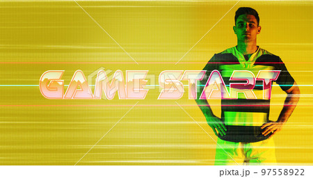 Game start text and glitch technique with caucasian rugby player standing on yellow background Game start text and glitch technique with caucasian rugby player standing on yellow background 97558922