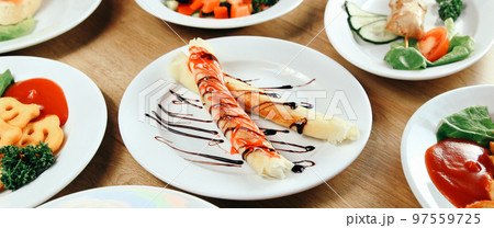 delicious dishes on the table in restaurant 97559725