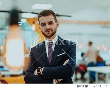 Portrait of a successful boss in a modern office Portrait of a successful boss in a modern office 97561226
