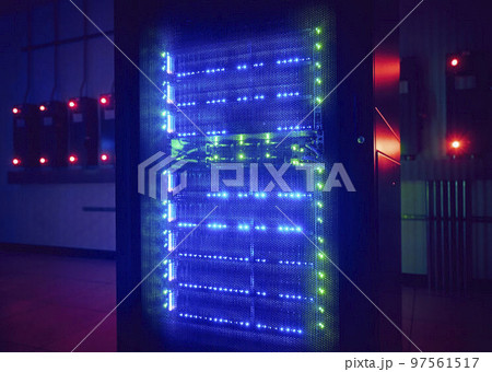 Glowing hard drives in dark server room 97561517