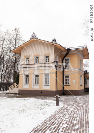 An old mansion with a wooden veranda, built in the 19th century An old mansion with a wooden veranda, built in the 19th century 97563034