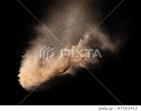 Small size fine Sand flying explosion, Golden grain wave explode. Abstract cloud fly. Yellow colored sand splash silica in Air. Element Black background Isolated high speed throwing freeze shot 97563452