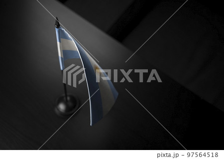 Small national flag of the Argentina on a black background 97564518